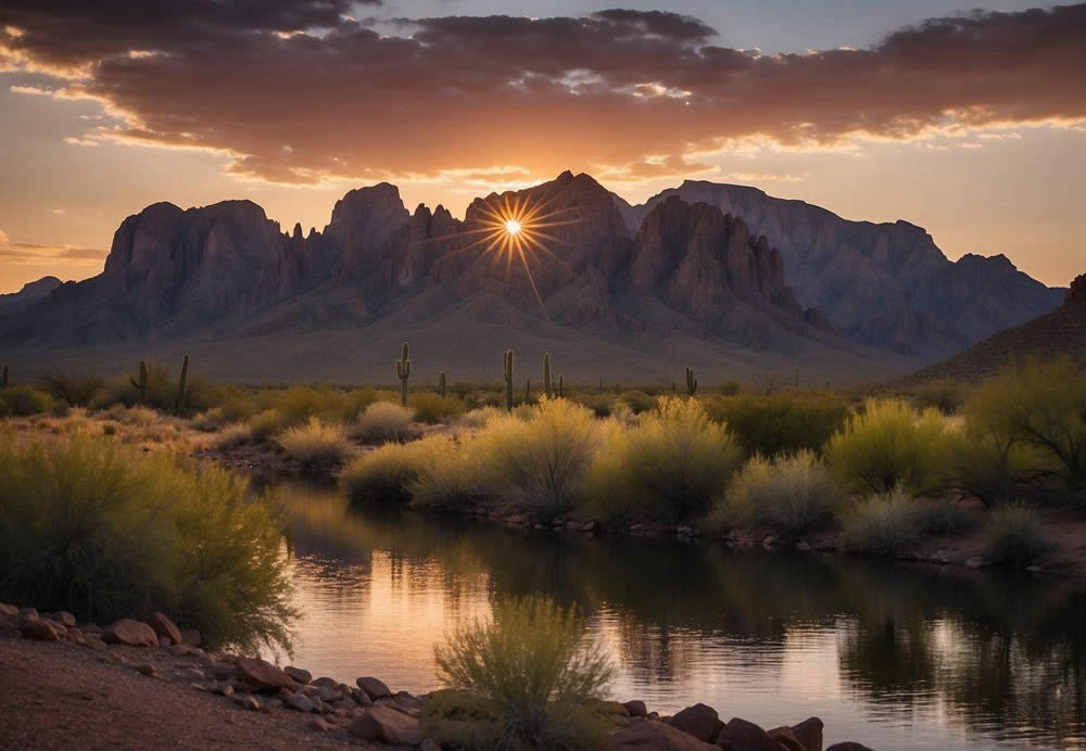 The sun sets behind the jagged peaks of the Superstition Mountains, casting a warm glow over the rugged terrain and the calm waters of Canyon Lake, where the Dolly Steamboat glides through the tranquil scene